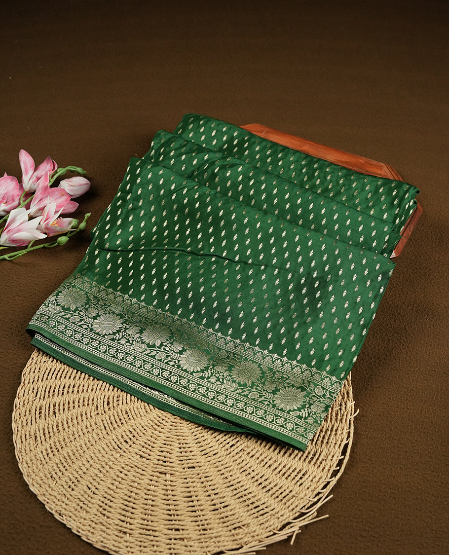 Green colour banaras satin crepe saree fearturing gold tiny leaf motifs on body, kodi visiri pattern on border & pallu and paired with matching blouse