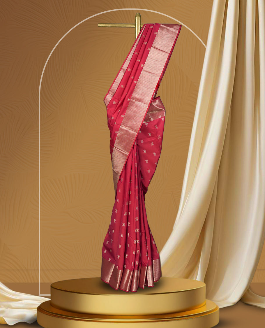 Raspberry pink colour soft silk saree featuring delicate zari buttas all over, paired with a lustrous golden zari border and pallu & Comes with a matching blouse.