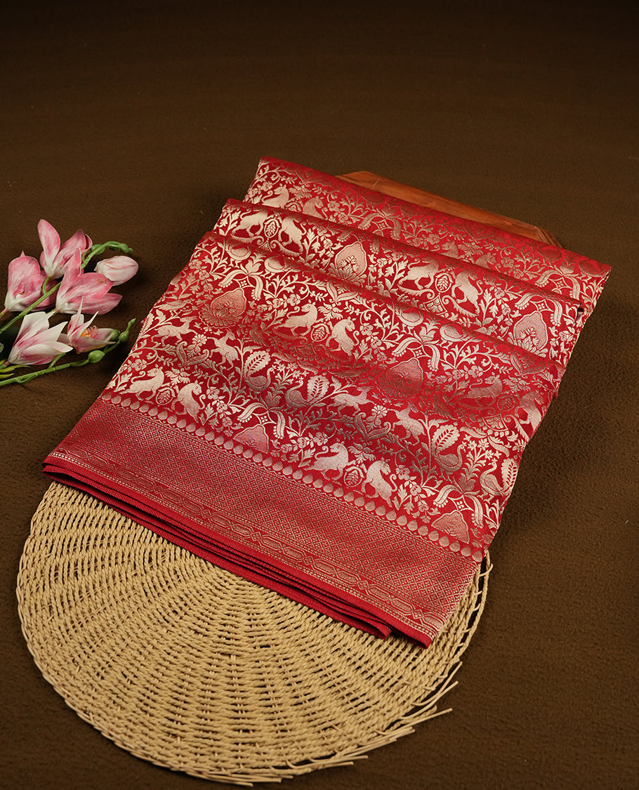 Dark red colour Mysore Crepe Silk saree fearturing gold Zari kodi visiri & Animal brocade pattern on body and self colour border paired with matching blouse