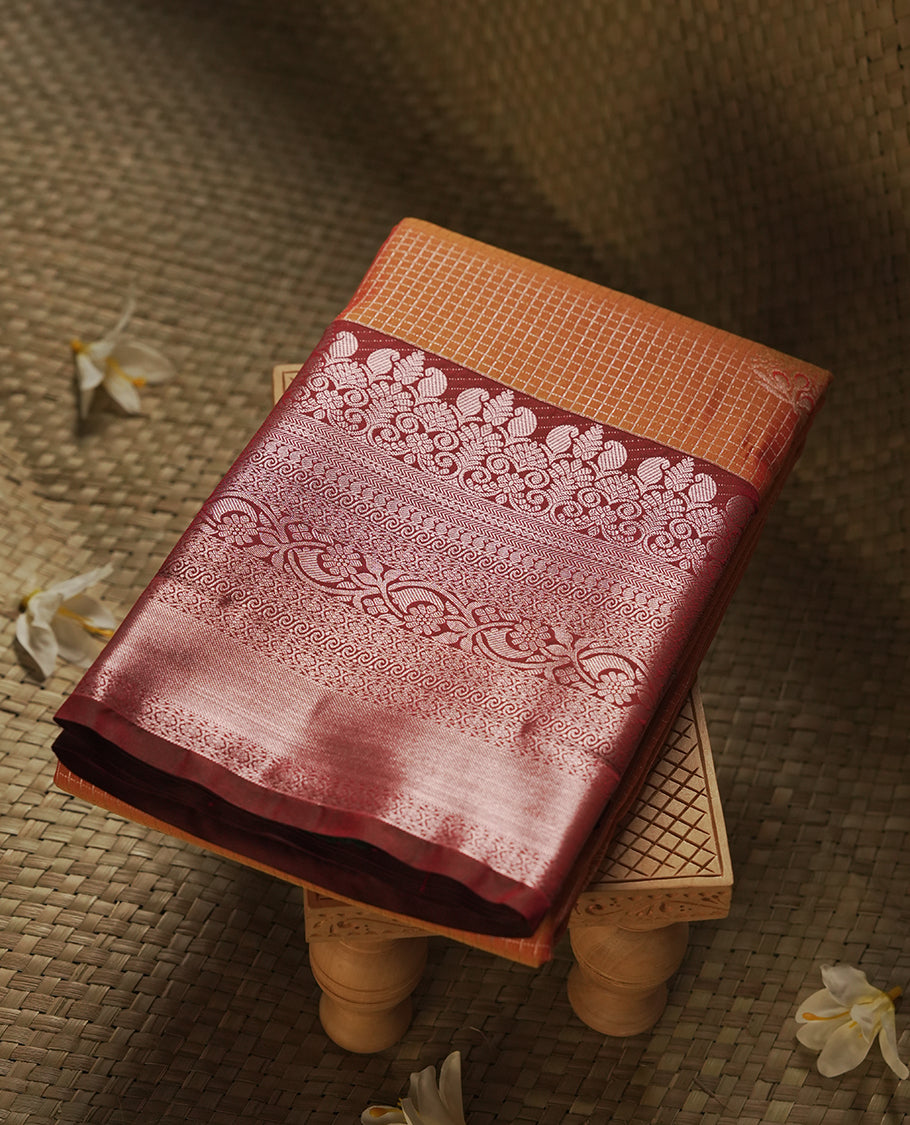Mustard orange colour Semi Silk Saree with gold zari stripes on the body, paired with a contrast deep red colour pallu with rose gold zari traditioal border, and a matching blouse piece.