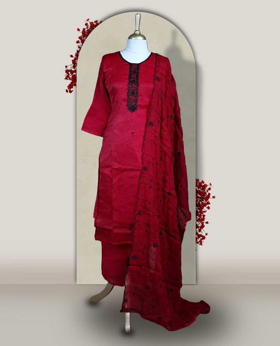 Maroon churidar set adorned with intricate black cut bead work on the neckline, paired with a matching bottom & The set comes with a lightweight embroidered dupatta, adding elegance and charm to your ethnic look.