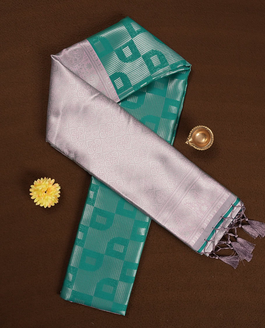 Mint Green colour Semi Silk Saree with Self-Checked Geometric Patterns, Contrasting Silver Zari Woven Pallu and Border with Intricate Motifs and Tassels, Paired with Coordinated Blouse Piece