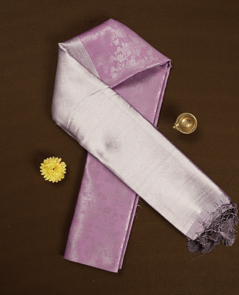 Light Lavender Colour Silk Saree with Allover Subtle Floral Self-Weave, Contrasting Silver Zari Woven Pallu and Border with Intricate Patterns and Tassels, Paired with Matching Blouse Piece