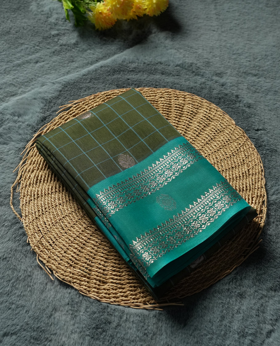 Olive Green Silk Cotton Saree with Silver Butta Body, Accented by Teal and Silver Zari Geometric Border on Teal Pallu, Paired with Matching Blouse Piece