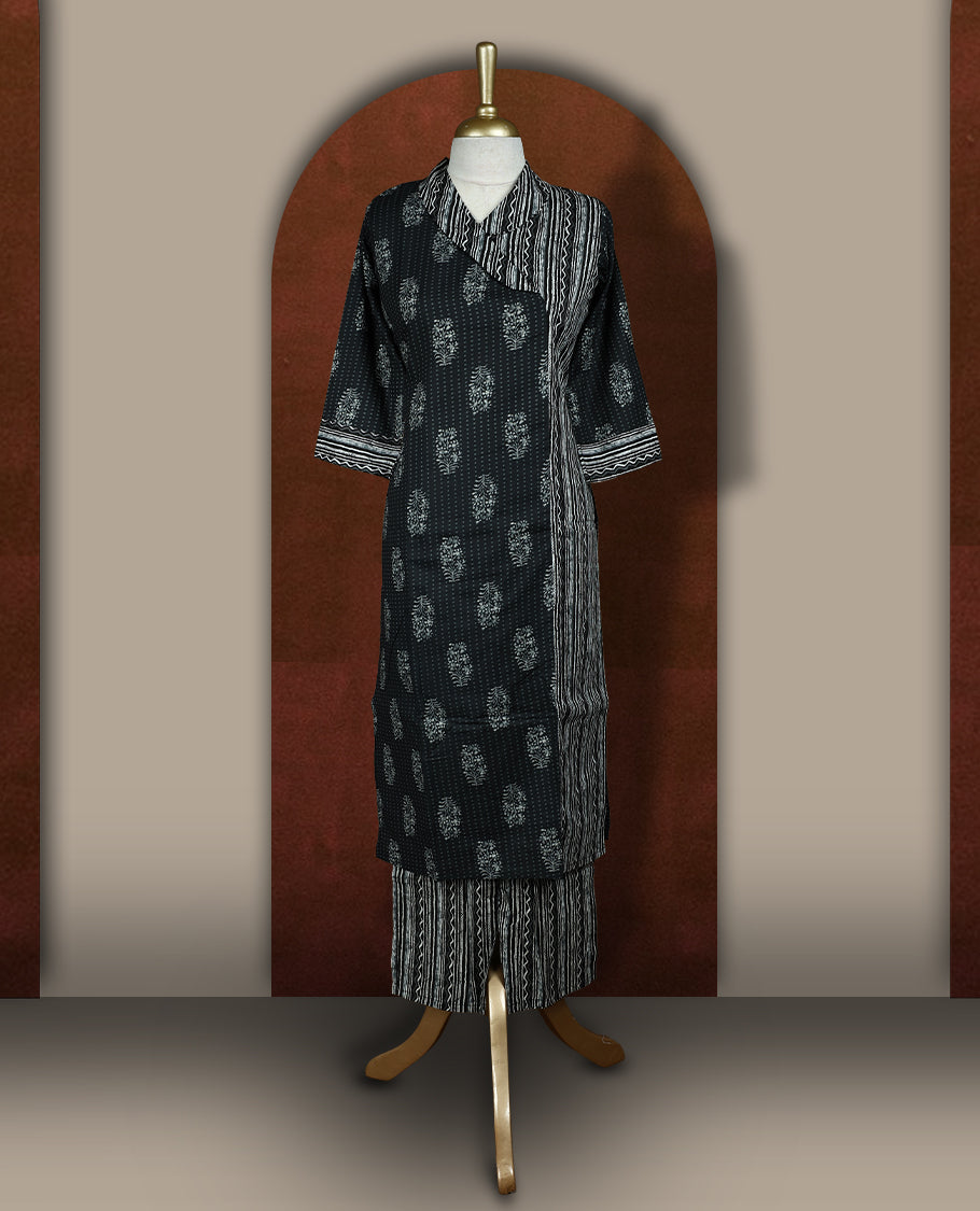 Black colour cotton coord set with floral and striped handblock prints, Features a stylish overlay design and elbow length sleeves & paired with matching striped wide leg pants.