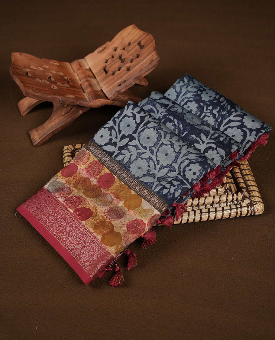 Dark blue colour chanderi silk saree featuring floral kodi print pattern across body, with contrast red colour border with zair pattern and paired with matching blouse.