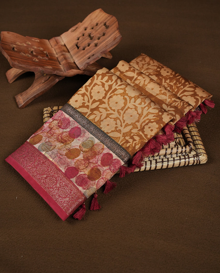 Mustard colour chanderi silk saree featuring floral kodi print pattern across body, with contrast red colour border with zari pattern and paired with matching blouse.