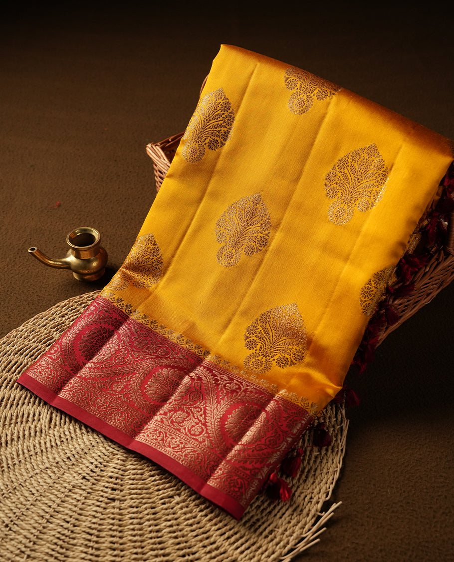 Mustard Colour Pure Banaras soft Silk Saree having gold floral motifs on Body with contrast Dark red colour gold Floral kodi pattern on Border and matching Blouse