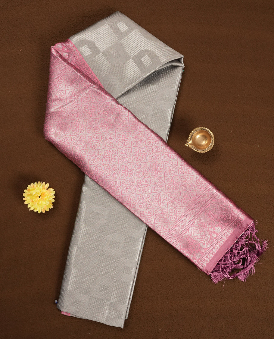 Silver Grey Colour Silk Saree with Self-Checked Geometric Patterns, Contrasting Pastel Pink Zari Woven Pallu and Border Featuring Floral Motifs and Tassels, Paired with Matching Blouse Piece
