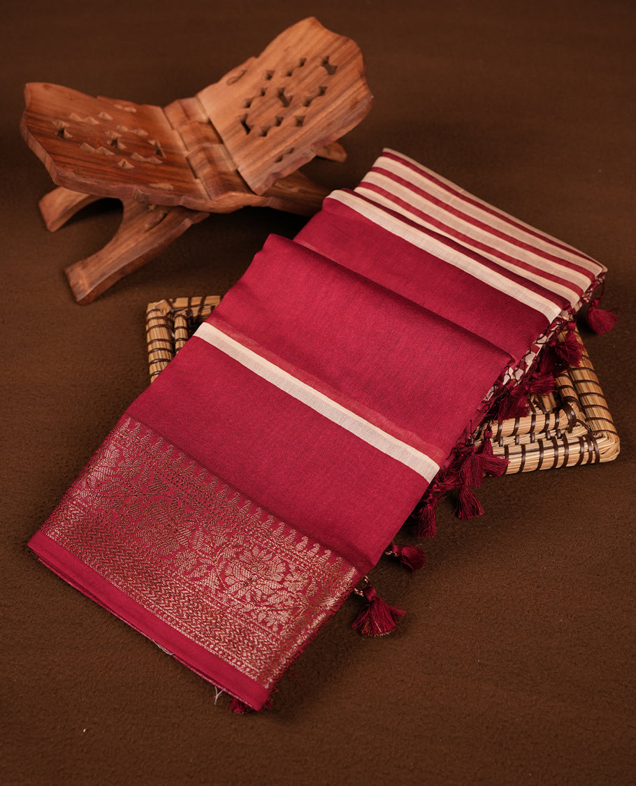 Red colour chanderi silk saree featuring white stripped print pattern across body, with Antique zari pattern border and paired with matching blouse.