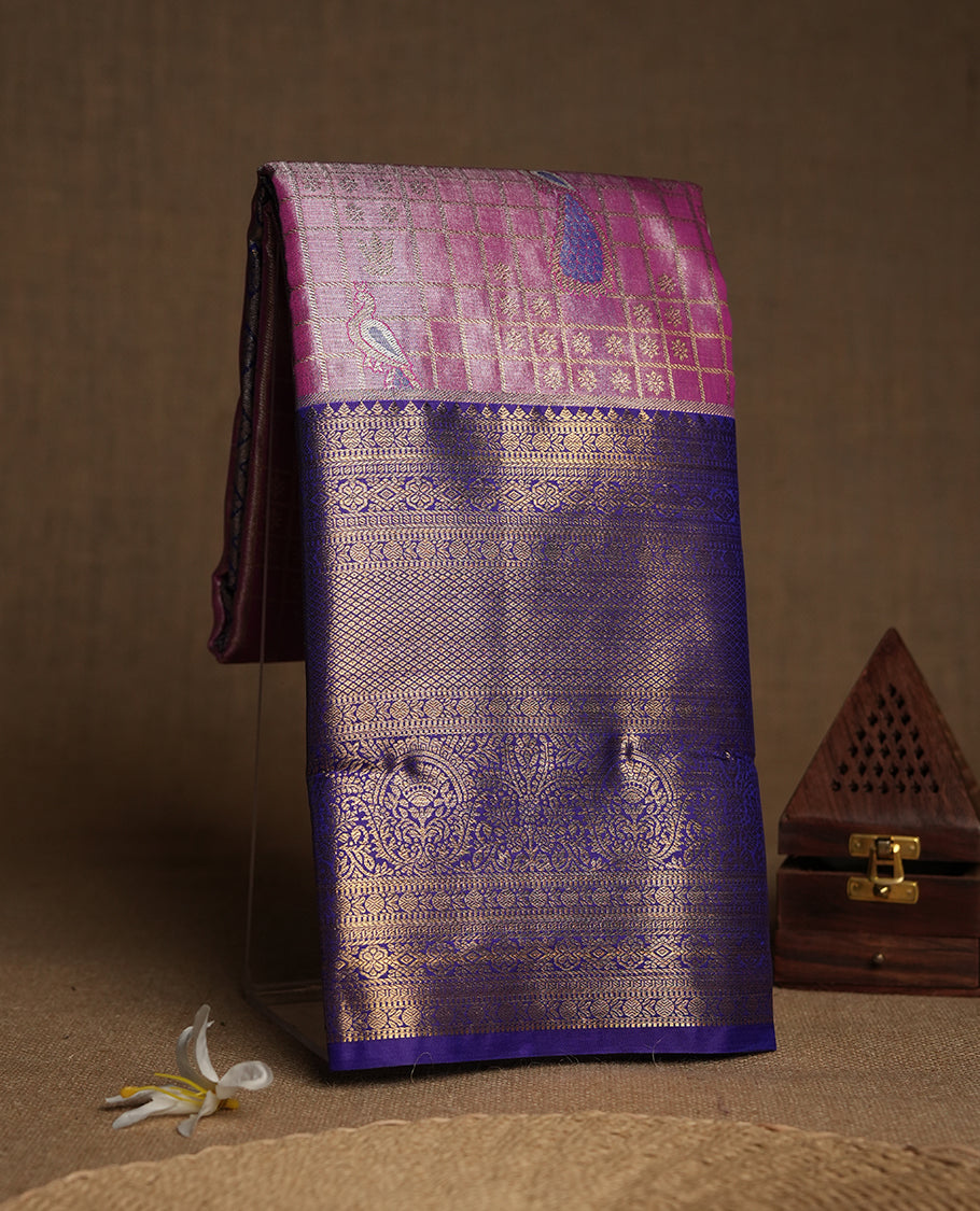 Hot pink colour and Antique gold Zari Tissue Brocade Saree features intricate check and bird Motifs on body and a trypan blue colour traditional border & pallu with floral patterns, paired with matching blouse