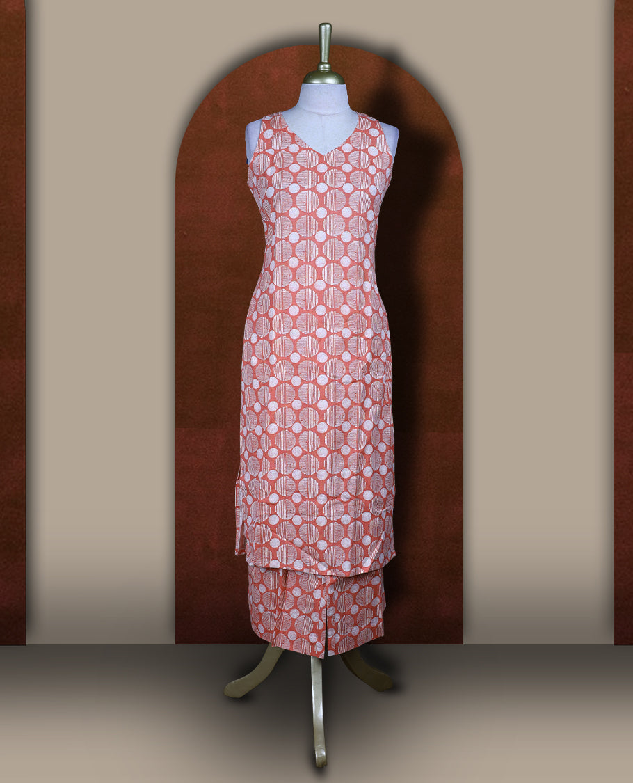 Peach colour cotton cord set with geometric off white prints, featuring a straight kurta with stylish sleeveless with side slits, paired with coordinated bottoms.