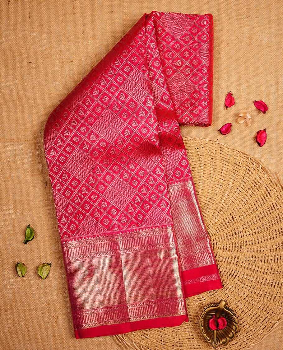 Rani pink colour Kanchipuram Samudrika Silk Saree featuring Daimond pattern weaving with gold zari jacquard and a traditional zari border, paired with a matching designer jacquard blouse piece