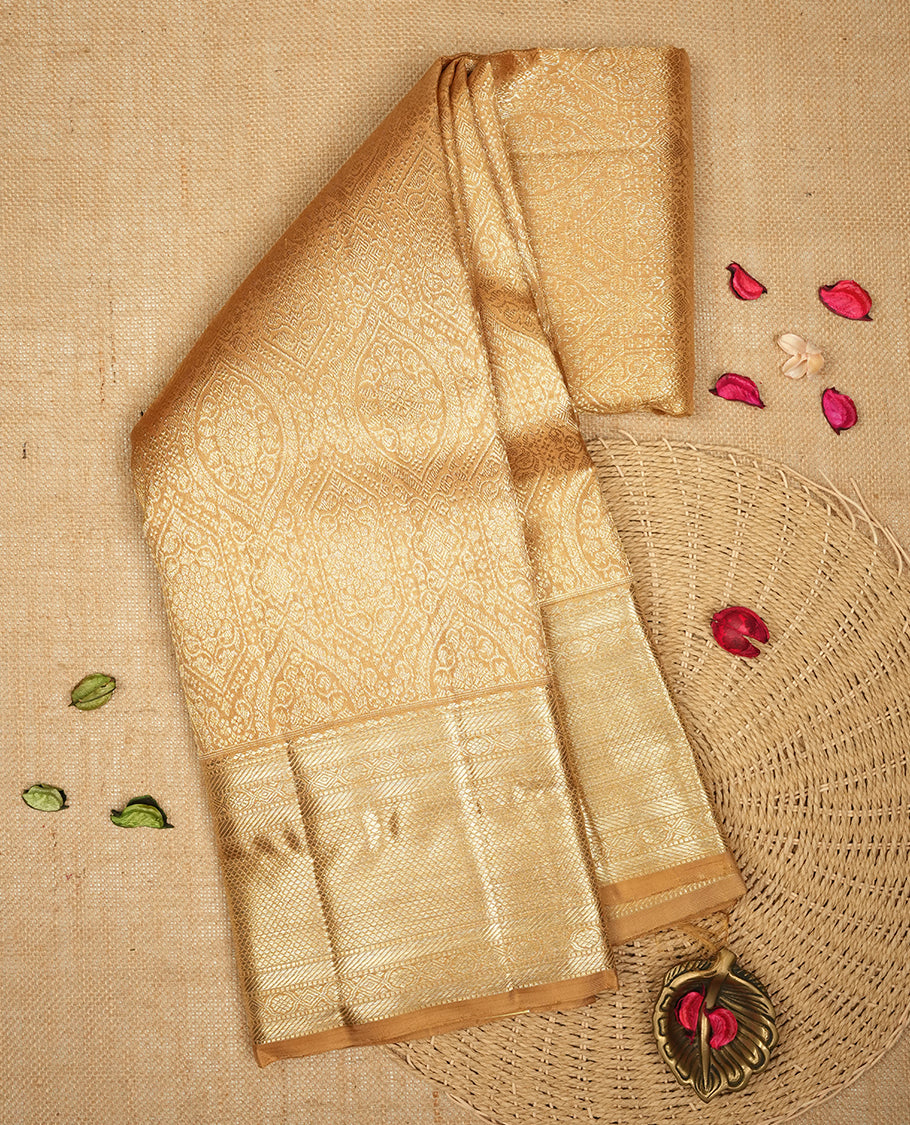 Gold colour Kanchipuram Samudrika Silk Saree featuring patterns weaving with gold zari jacquard and a traditional zari border, paired with a matching designer jacquard blouse piece