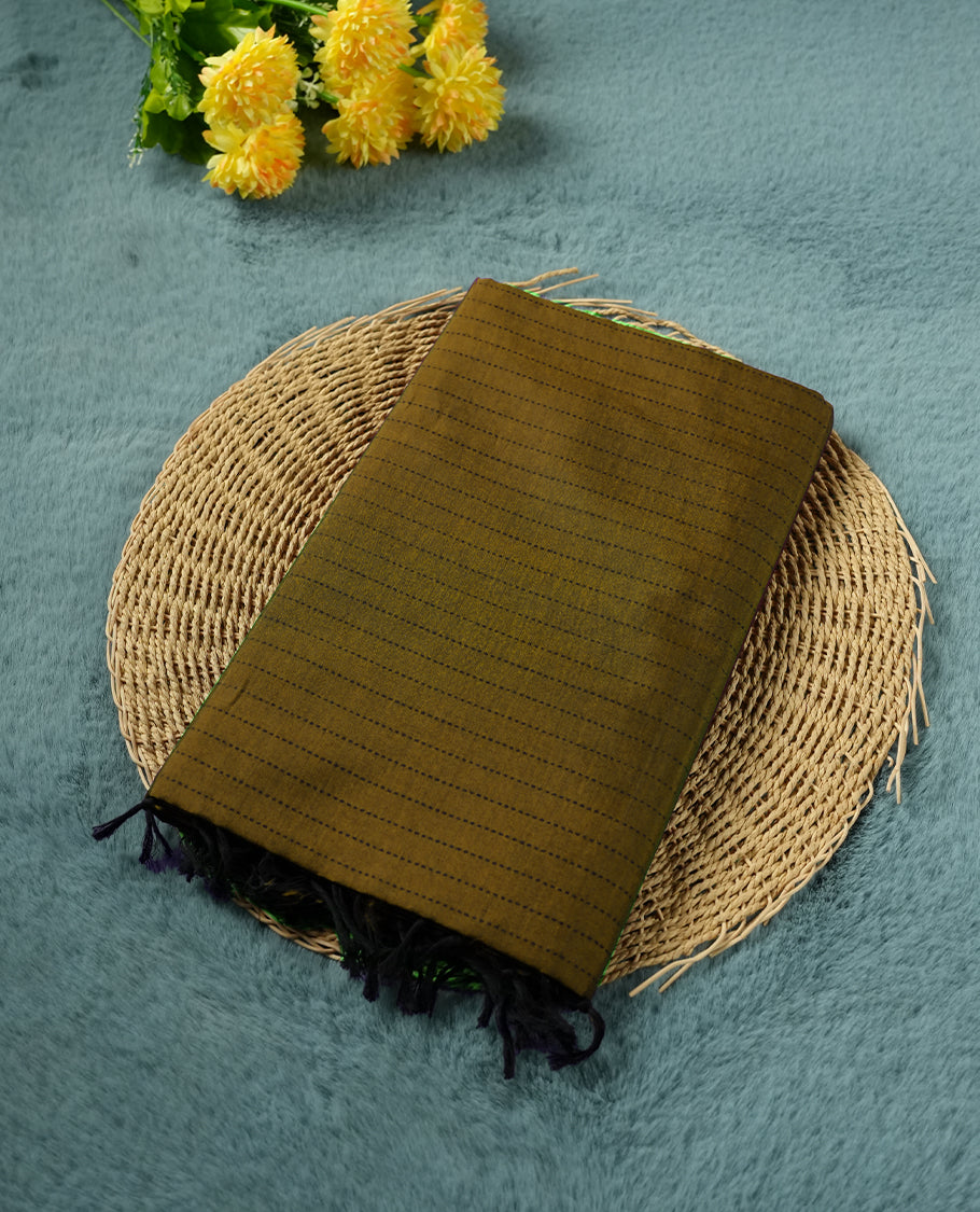 Dark Mustard colour poly cotton saree with black vertical dotted line pattern on the body, paired with a matching pallu featuring zigzag geometric border, and a coordinated all‑over black stylised fleur‑de‑lis printed blouse piece.
