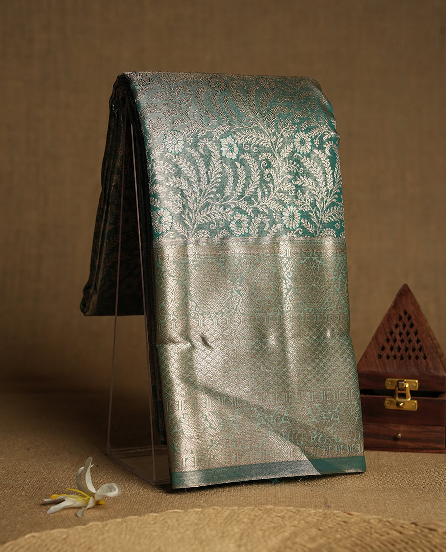 Seafoam green and Antique gold Zari Tissue Brocade Saree features intricate floral Motifs on body and traditional border & pallu with floral patterns, paired with matching blouse