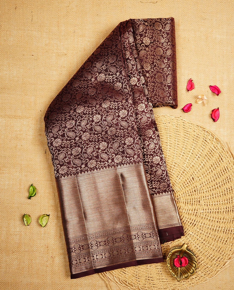 Chocalate brown colour Kanchipuram Samudrika Silk Saree featuring Floral kodi pattern weaving with gold zari jacquard and a traditional zari border, paired with a matching designer jacquard blouse piece