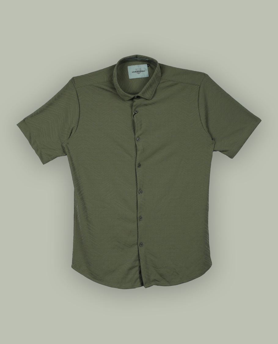 Pastel olive green colour textured shirt featuring a subtle chevron pattern, classic collar, and short sleeves & Crafted for effortless comfort and style.