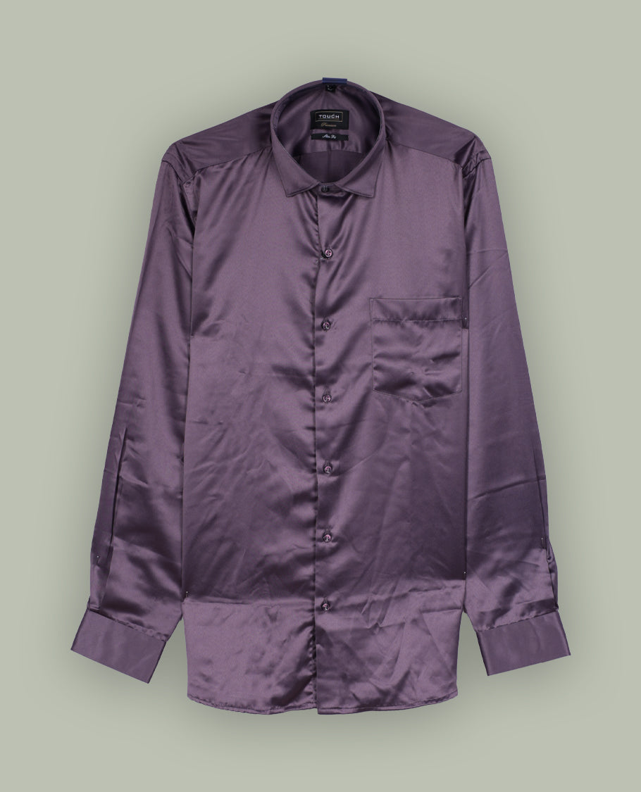 Rich purple colour satin shirt with a glossy finish, featuring a classic collar and full sleeves with broad cuffs, Designed with a front pocket and button-down style, adding a refined touch to formal or party looks.