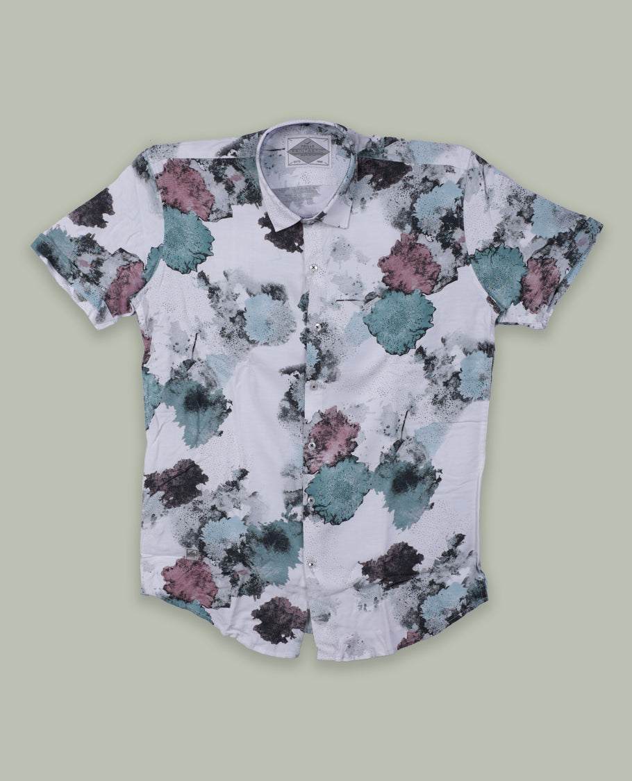 White colour short sleeve shirt features a rounded spread collar and a watercolor style floral print in teal, maroon, and black & its ideal for both casual days and laid back evenings.