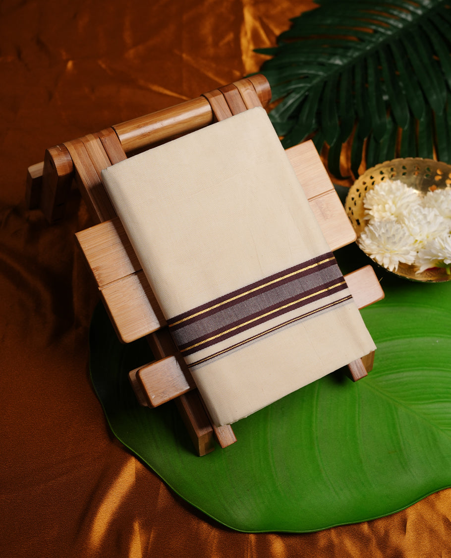 Cream colour cotton double dhoti featuring brown and gold zari border
