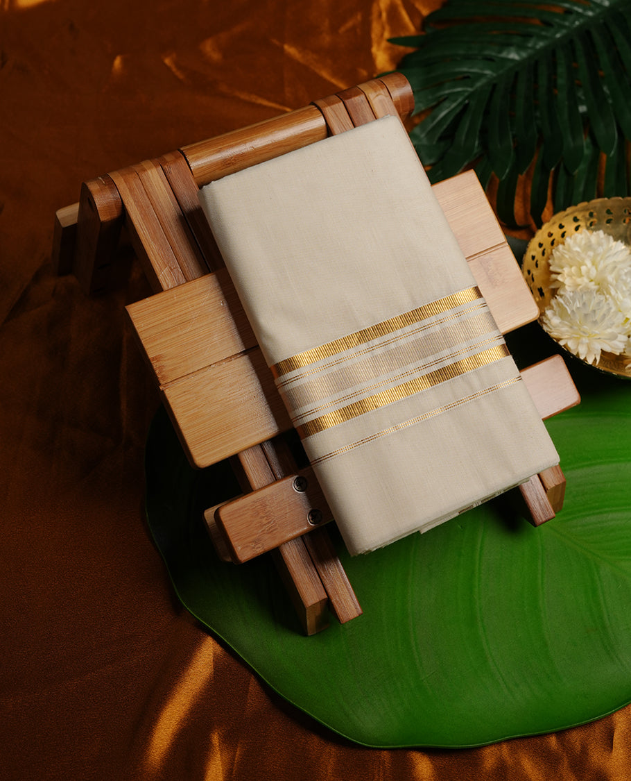 Cream colour cotton double dhoti featuring gold stripes kasavu zari border