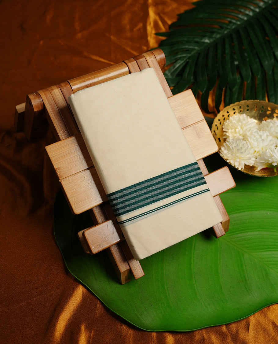 Cream colour double dhoti featuring dark green colour stripes zari border