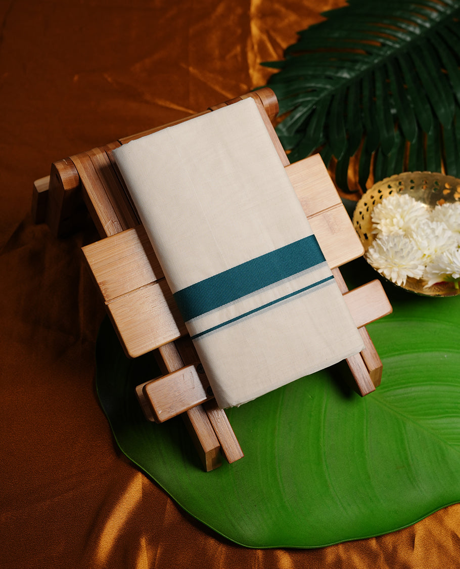 Cream colour cotton double dhoti featuring teal green colour border