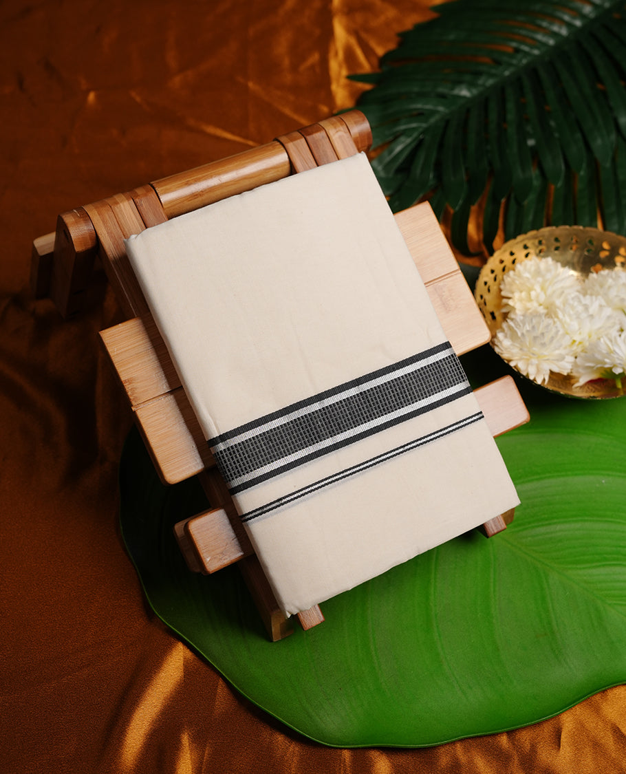 Cream colour MCR double dhoti featuring black and silver colour kasavu zari border