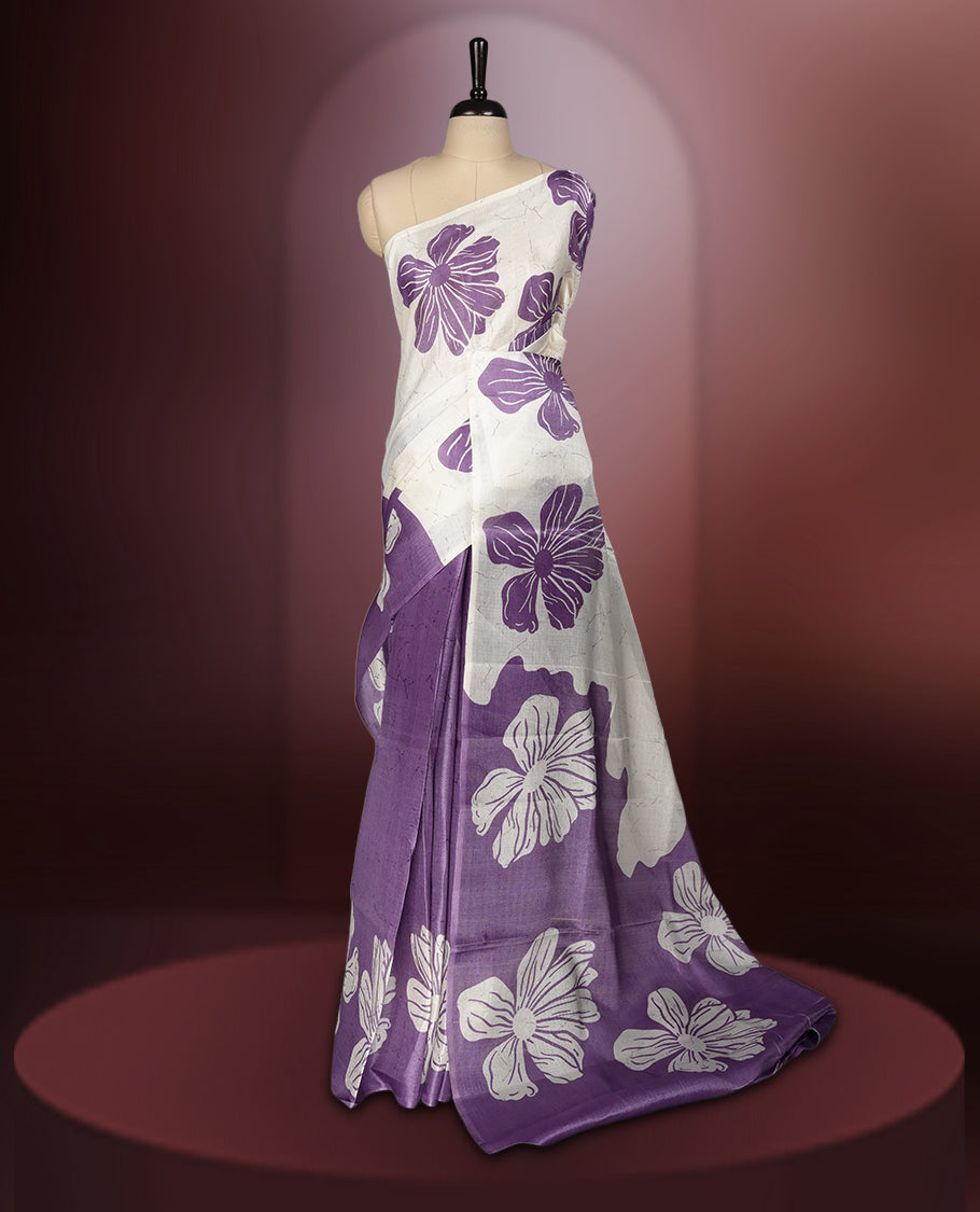 Off white colour semi khadi silk saree with light violet floral motifs and subtle , exuding timeless elegance and modern charm & paired with a matching blouse.