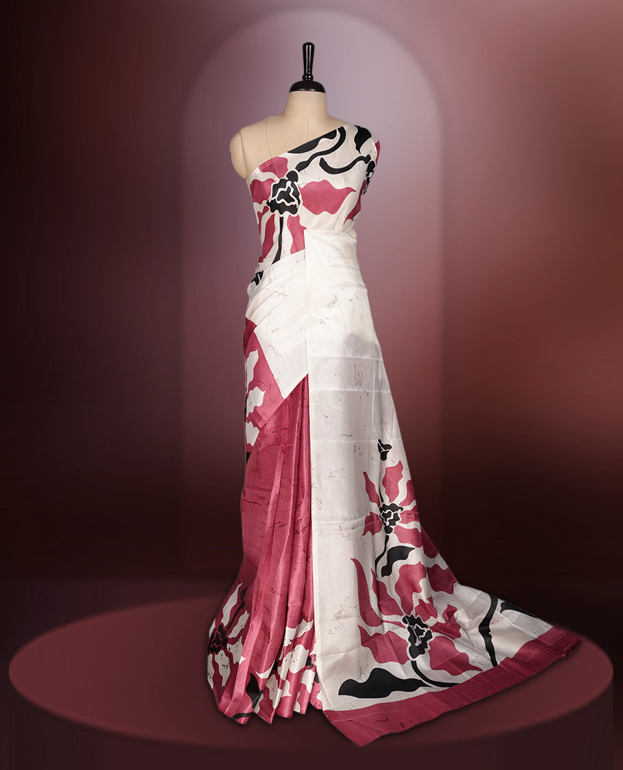 Dark onion pink colour saree with striking off white, black floral patterns, merging modern minimalism with timeless charm & paired with a matching blouse.