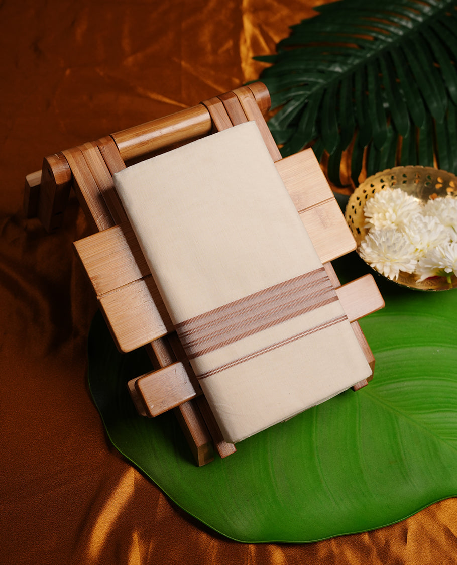 Cream colour cotton double dhoti featuring muted brown colour border
