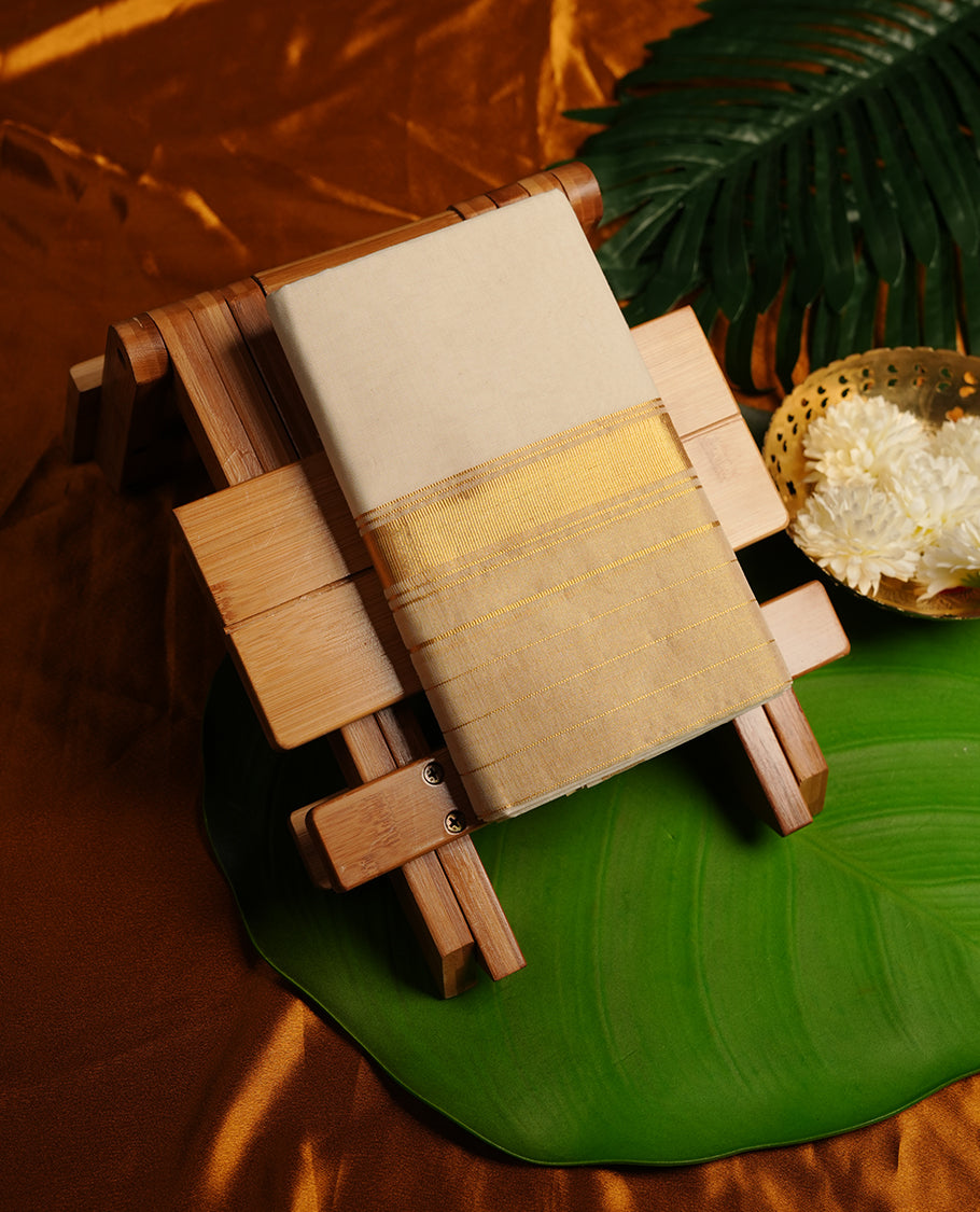 Cream colour cotton double dhoti featuring gold kasavu zari border.