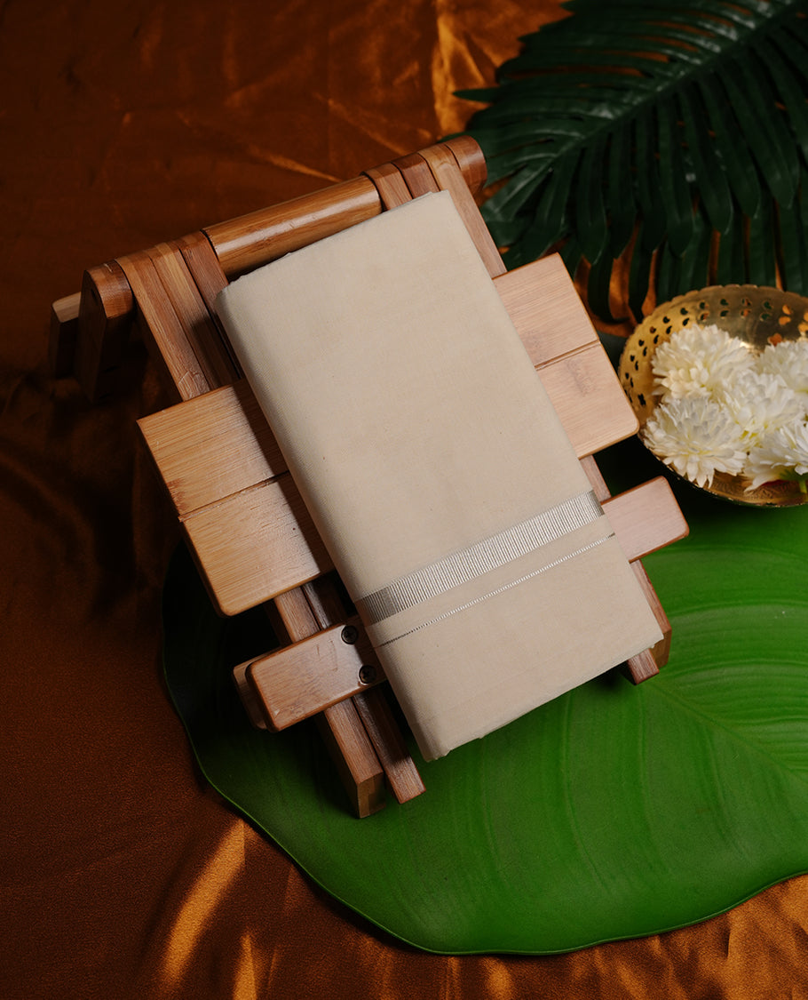 Cream colour double dhoti featuring silver colour kasavu zari border