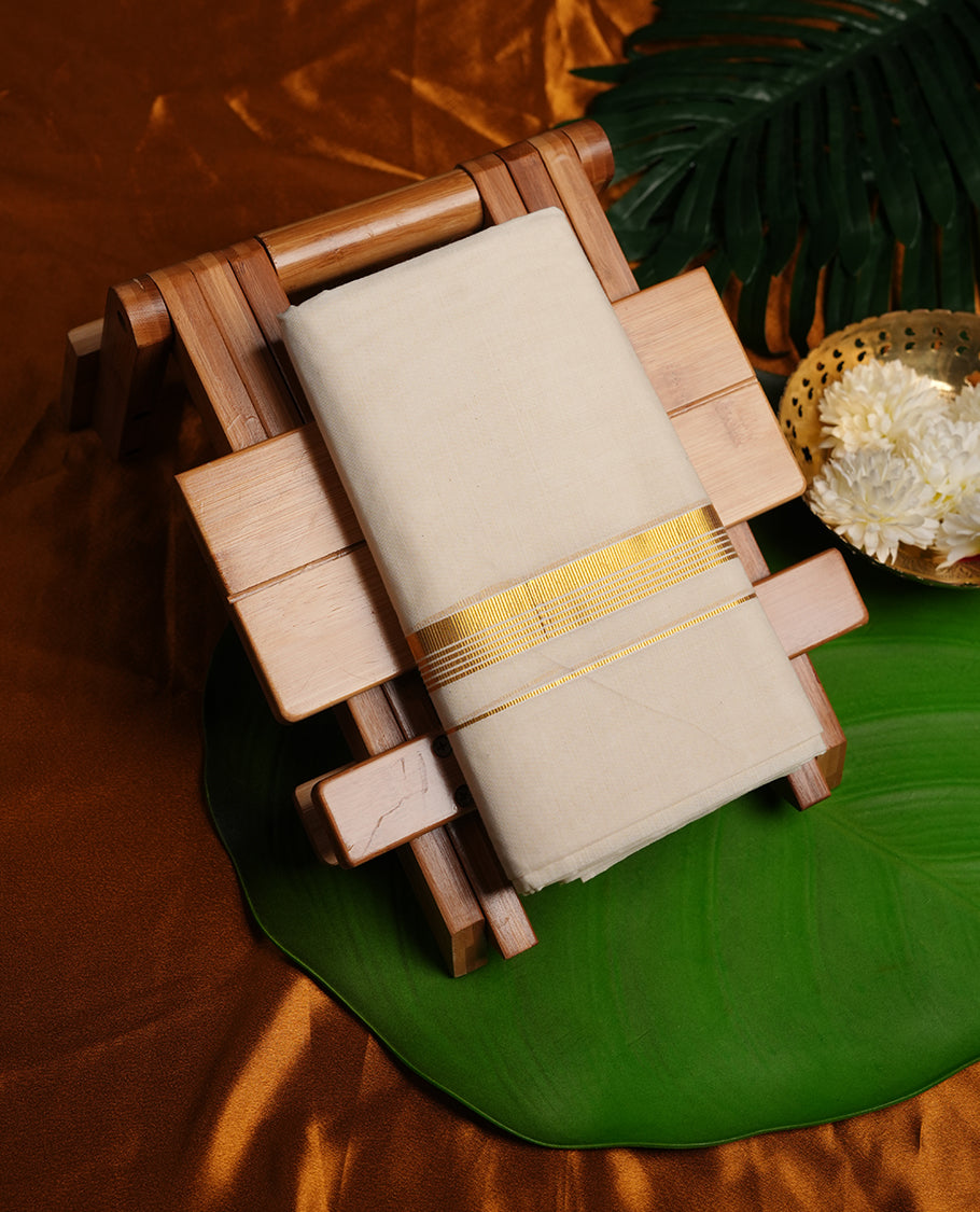 Cream colour cotton double dhoti featuring gold stripes kasavu zari border