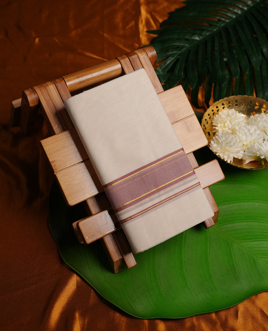 Cream colour cotton double dhoti featuring mauve and gold border