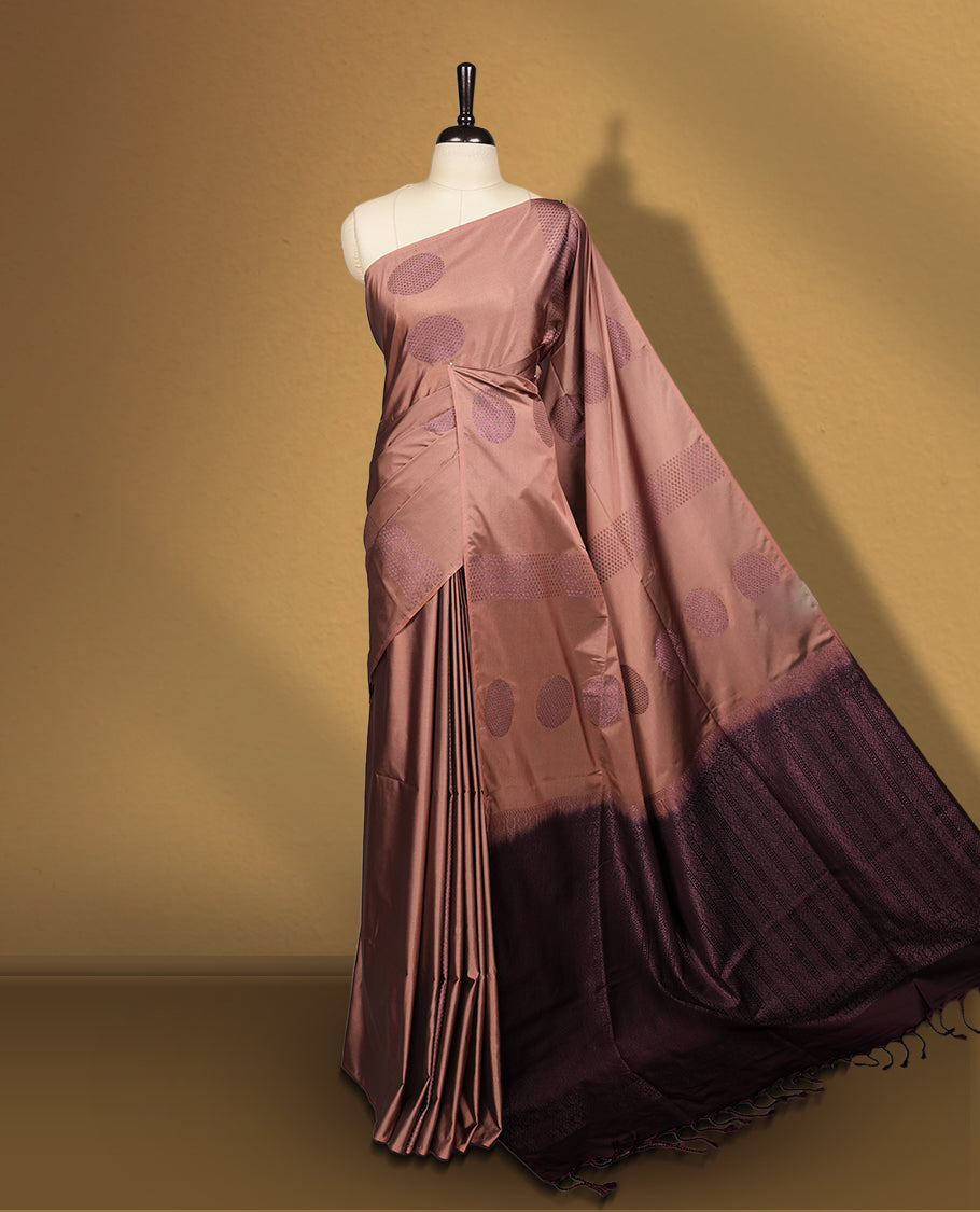 Mavue brown colour semi soft silk saree, beautifully designed with woven circular motifs & The look is enhanced by a rich contrast dark chocolate brown border and pallu, paired with a matching blouse.