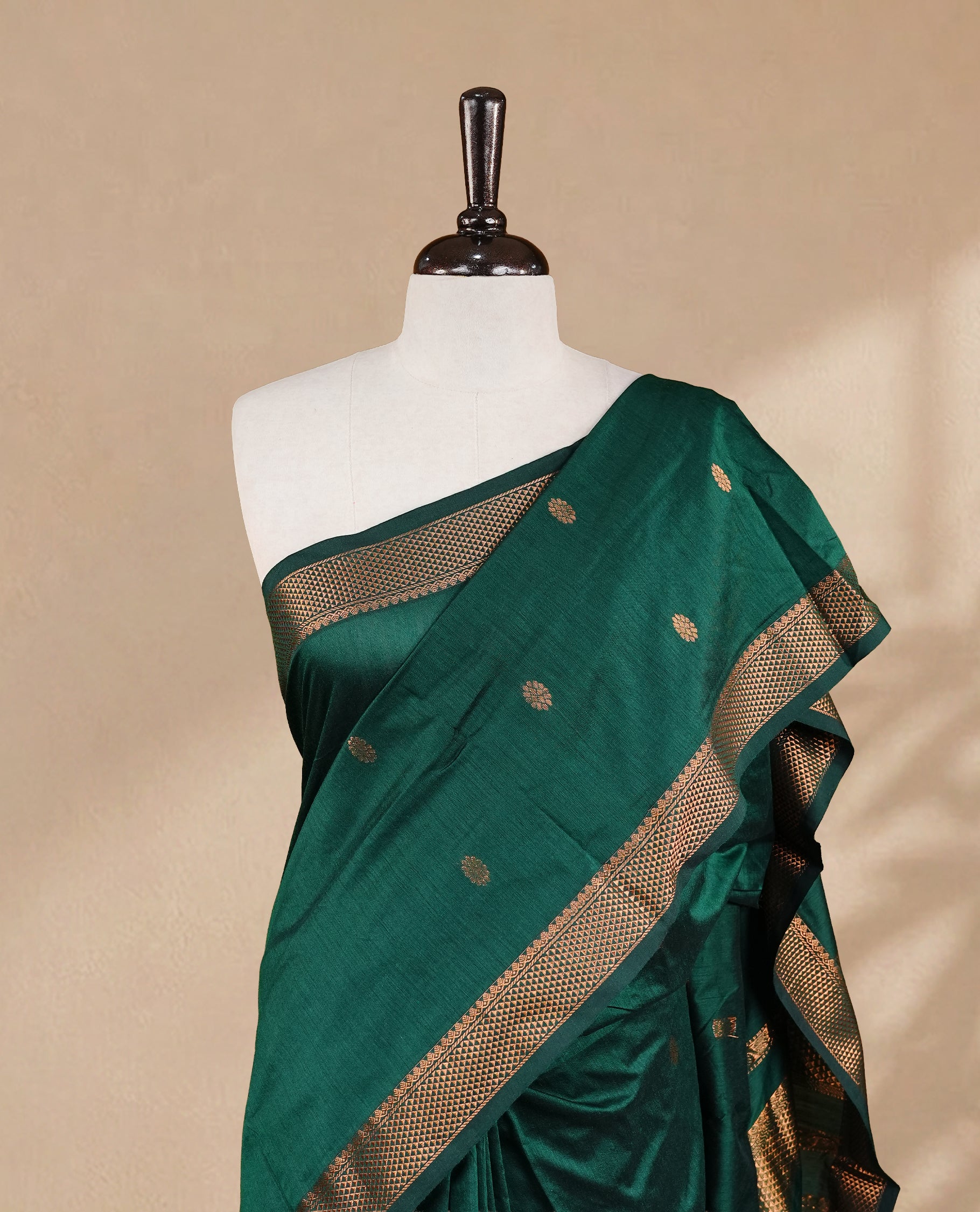 Green colour kalyani cotton saree featuring antique zari motifs on body, complemented by Self colour with Antique zari border, paired with matching blouse piece.