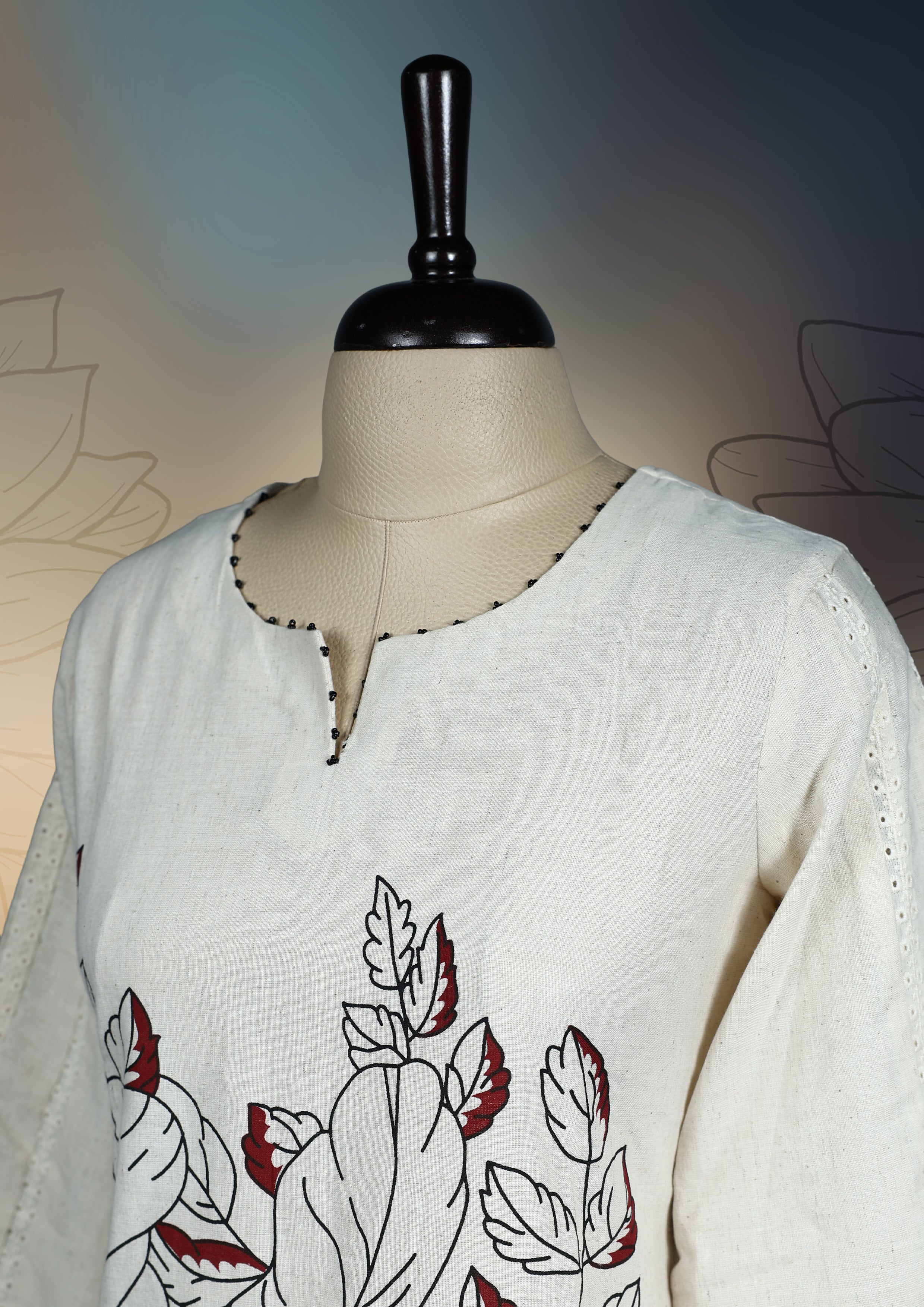 Off white colour kurthi with bold black floral prints and dark maroon accents, featuring three quarter sleeves with contrast edging & Perfect for casual or semi formal wear, pairs beautifully with leggings or palazzos.