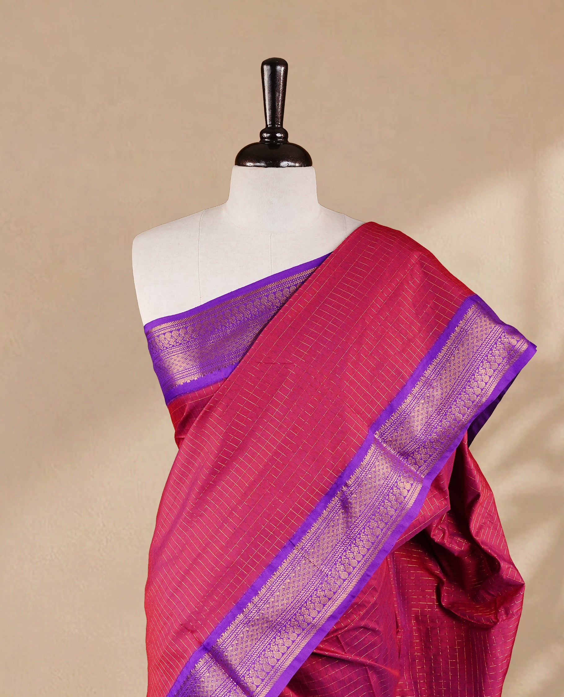 Maroon colour kalyani cotton saree featuring gold zari check pattern on body, complemented by Violet colour with Antique zari border, paired with matching blouse piece.