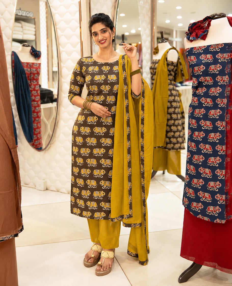 Brown Colour Cotton salwar material Featuring Contrast colour Elephant motifs on body with neat piping border, paired with matching chanderi material dupatta.