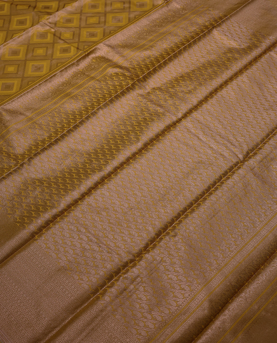 Mustard Colour Tissue Saree having Zari Worked Body with Brocade Border and Blouse