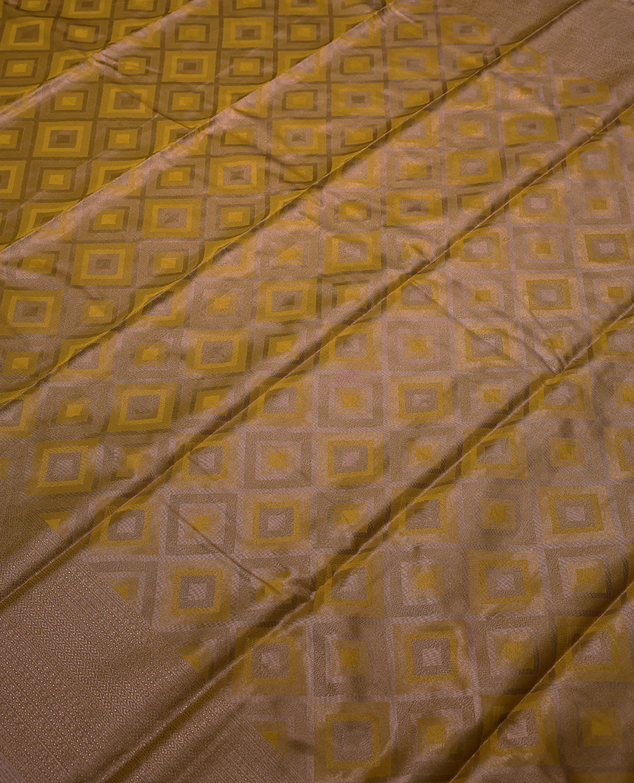Mustard Colour Tissue Saree having Zari Worked Body with Brocade Border and Blouse