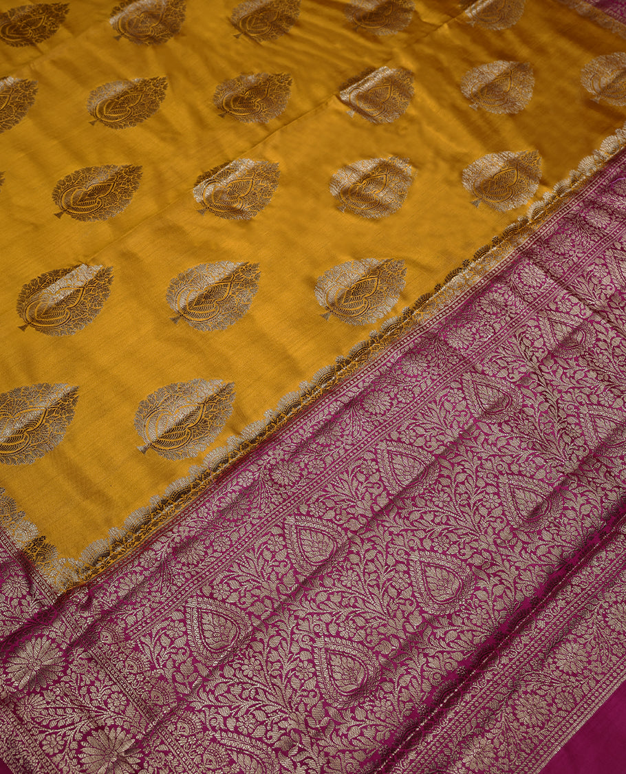 Mango Yellow Colour Banarasi Silk Saree having Golden Leaf Work in Body with Dark Magenta Colour Blouse and Border