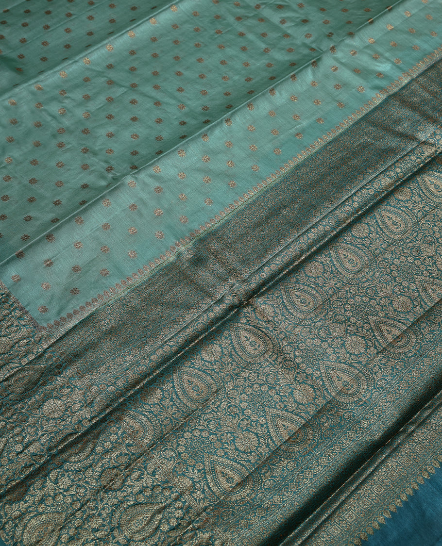 Pastel Pista Colour Tussar Banarasi Silk Saree having Golden Buttas in Body with Dark Blue Colour Blouse and Border