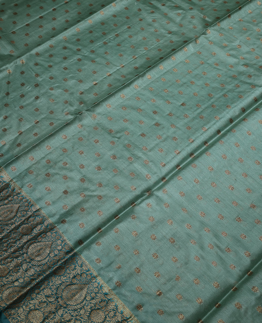 Pastel Pista Colour Tussar Banarasi Silk Saree having Golden Buttas in Body with Dark Blue Colour Blouse and Border