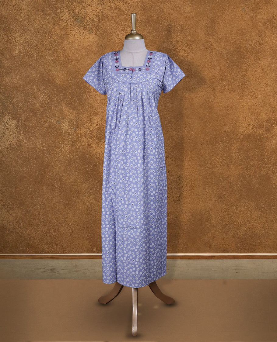 Light lavender colour NStyle nighty featuring White floral patterns, a Square neckline and thread pattern, short sleeves, and a full ankle-length design.