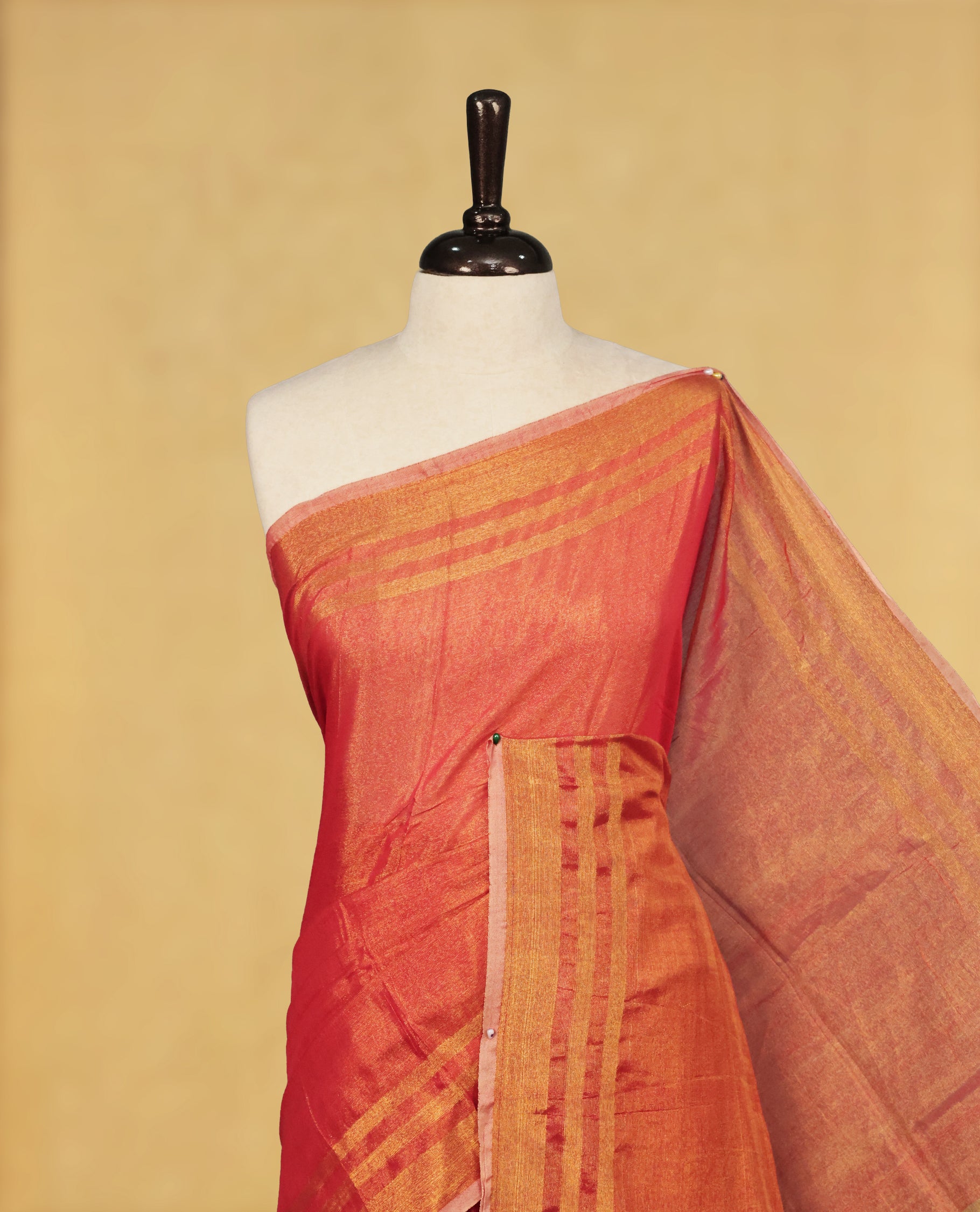 Red colour Semi Tissue Silk saree featuring Elegant plain body, Enhanced with Gold tissue Border & Striped Pallu & beautiful Tassels for Elegant Prefect Look.