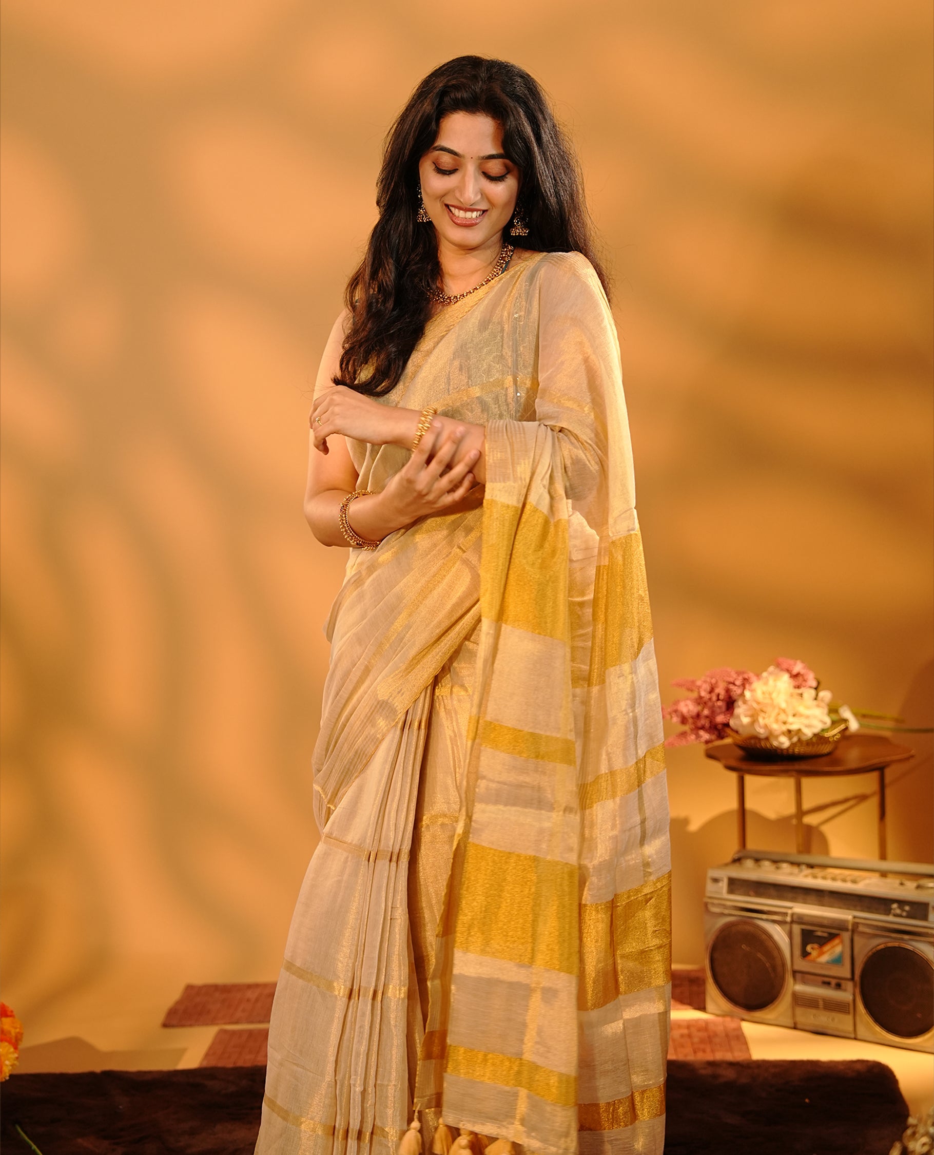 Golden Khadi Tissue Saree Featuring Bold gold stripes on body, Complemented by Kasav border for Onam special