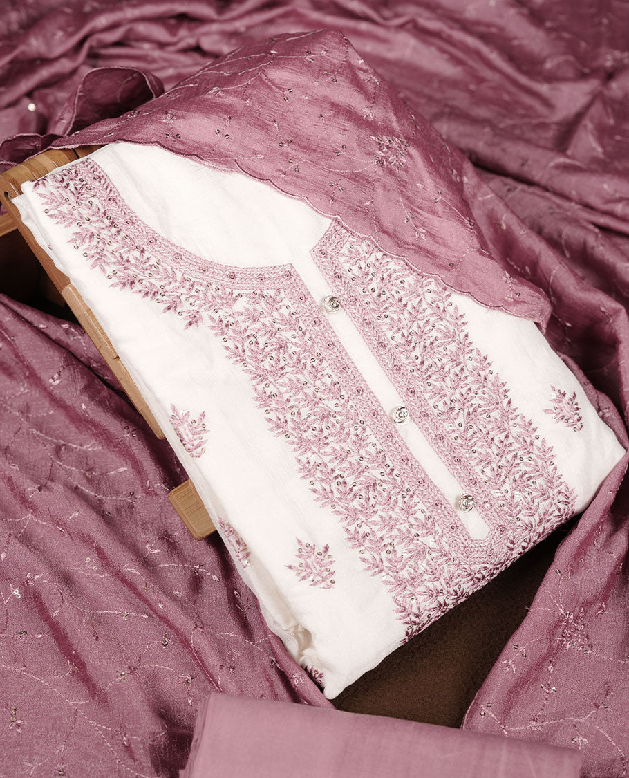 Ivory colour churidar material with soft pink colour thread embroidery on the front panel, paired with a matching blush pink dupatta and bottom.